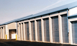 Self storage building exterior with blue doors