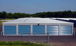 Self storage building exterior with blue doors
