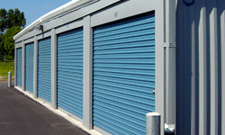 Self storage building exterior with blue doors