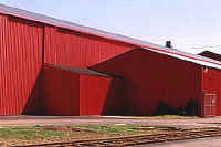 Exterior of building with red metal siding